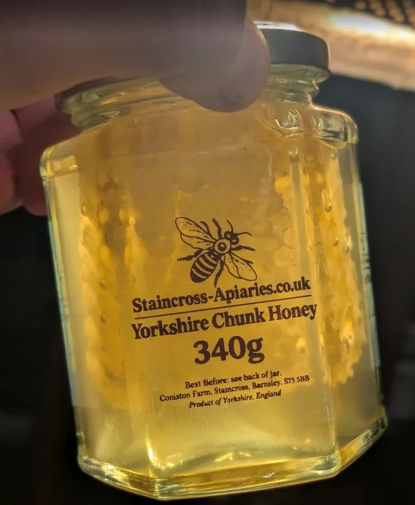 Jar of Yorkshire chunk honey with a piece of natural honeycomb